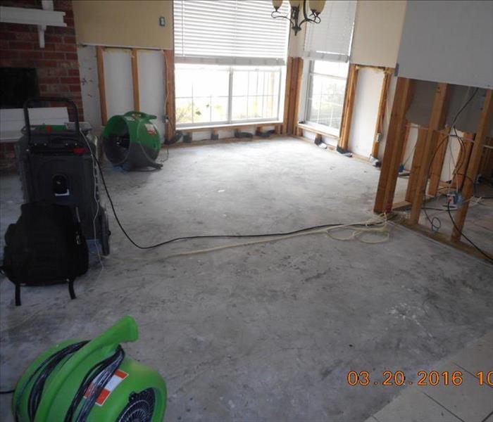 Air movers drying a home effected by flood damage